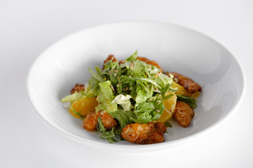  salad with chicken steak, salad mix, orange, cheese. Under the olive oil.