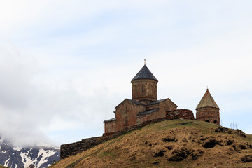 Gergeti Trinity Church (Tsminda Sameba), Holy Trinity Church near the village of Gergeti in Caucasian mountains, Georgia