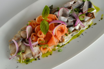 Fish mix with vegetables. Cold appetizer