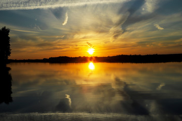 Beautiful sunset with clouds on the Volga river