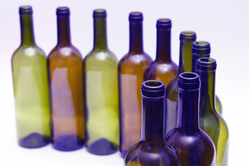 empty bottles of wine on white background