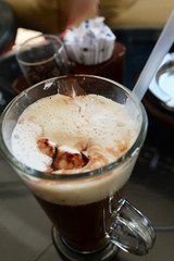 cappuccino in glass in cafe