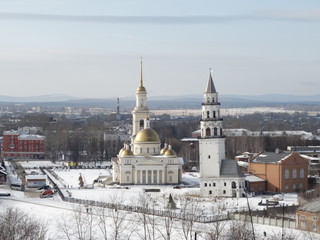 Fototapeta na wymiar The center of Nevyansk: Old Believers' church (domed), the Leaning Tower (white spire), Sverdlovsk Oblast, Russia