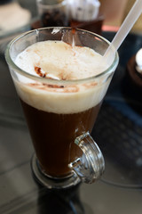 cappuccino in glass in cafe