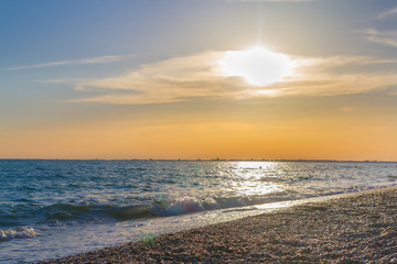 Beautiful summer sunset with clouds over the sea