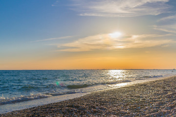 Beautiful summer sunset with clouds over the sea