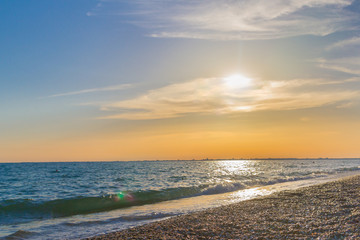 Beautiful summer sunset with clouds over the sea