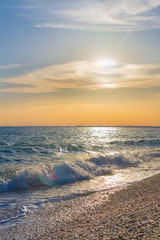 Beautiful summer sunset with clouds over the sea