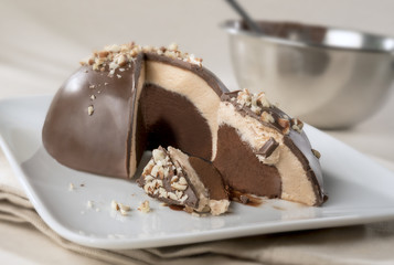 Round Tartufo ice cream.  Two flavor frozen dessert with hard shell covering