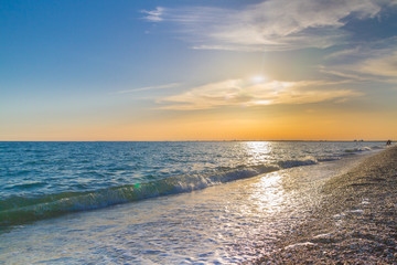 Beautiful summer sunset with clouds over the sea