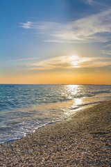Beautiful summer sunset with clouds over the sea