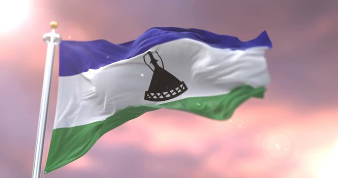 Lesotho flag waving at wind at sunset in slow, loop