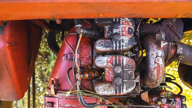 The engine of an old tractor that works in the field, the top view