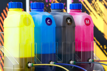 Color ink tank or large printer machine in factory for printing business.