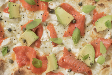Close-up of a delicious smoked Salmon Pizza. Delicious smoked Salmon Pizza