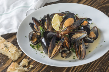 Mussels cooked with lemon and white wine.  Seafood plate specialty of both France and Belgium