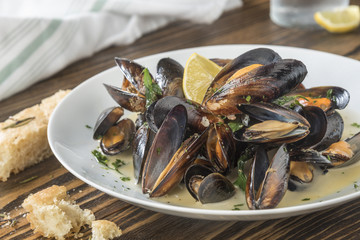Mussels cooked with lemon and white wine.  Seafood plate specialty of both France and Belgium