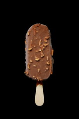 Chocolate ice lolly with almonds on the black isolated background. Ice cream bar,summer hot day. Cold yummy ice cream .Ice cream concept background.