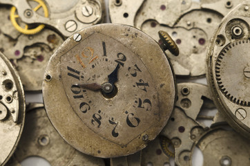 Vintage clock face isolated on the clockwork background