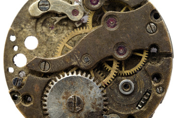Vintage old clockwork isolated on the white background. Macro Mechanical Gear Background
