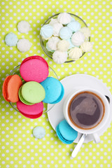 Fototapeta na wymiar A cup of coffee and macaroons ready for breakfast