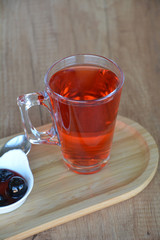 Hot mulled wine on a glass cup.