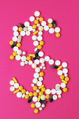 Medicine forming a sign of dollar as a concept of high cost of healthcare