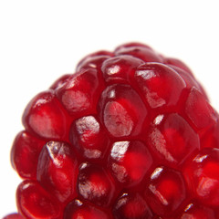 peeled pomegranate fruit closeup on white background