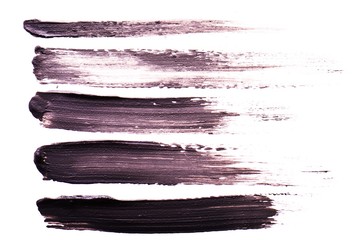 Set of Black strokes of mascara on a white background. Texture of black mascara for eyelashes...