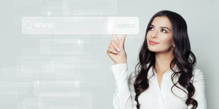Successful business woman pointing to blank address bar in virtual web browser. Seo, internet marketing or distance learning concept