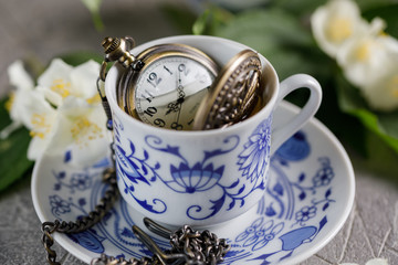 A cup of tonic green tea with jasmine and an onion bulb inside.