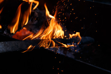 fire flames with sparks on a black background