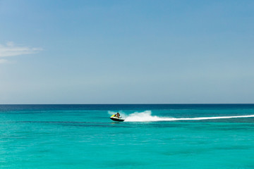 Jet ski rider on tropical pristine beach in Barbados