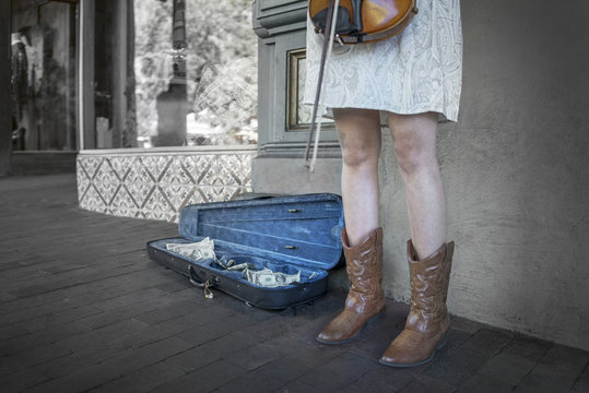 Country Musician Busker. Young Woman Working On The Street