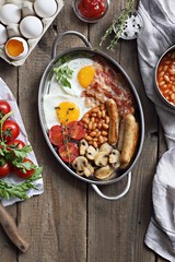 Traditional Full English Breakfast. Rustic style photography. Overhead 