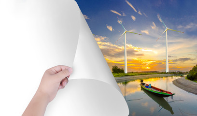 Change the world with our hands. White paper became a natural landscape, including wind turbines. Inspire the environment by stripping white paper together.