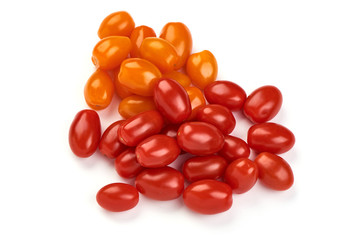 Ripe fresh orange and red cherry tomatoes, isolated on white background. Close-up.