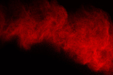 Abstract red powder splatted background,Freeze motion of color powder exploding/throwing color...