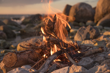 fire burns near the sea