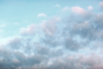 Clear blue sky with plain white cloud with space for text background.