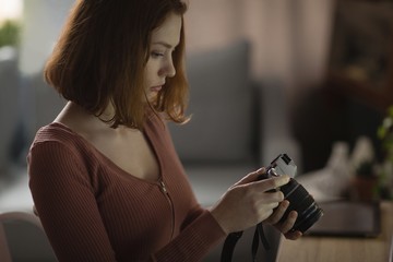 Woman reviewing features on camera