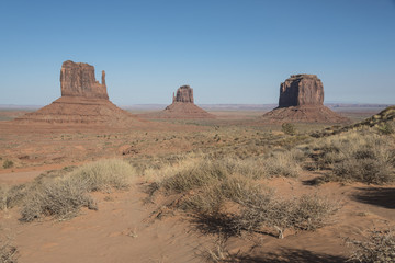 Naklejka premium Monument valley buttes Panoramic grand view of the buttes and mesas found in the Monument Valley in Utah and Arizona, USA