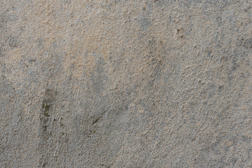 Wall fragment with scratches and cracks