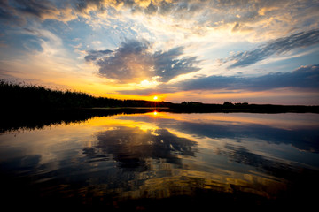 Fototapeta na wymiar sunset scene on lake