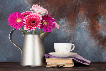 Gerbera flowers bouquet and coffee cup