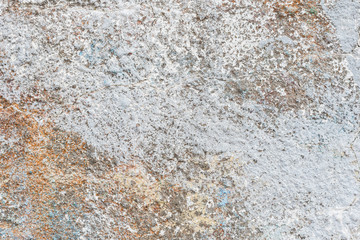 Wall fragment with scratches and cracks