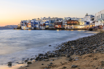Fototapeta na wymiar Little venice from beach in old town part of Mykonos, Greece during sunset