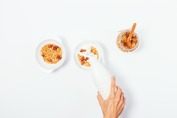 Woman doing healthy nut granola breakfast for two