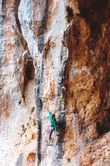 Fototapeta premium A rock climber on a rock.
