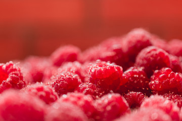 Background texture of dripping raspberry.